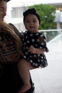 miami-fashion-blogger-kimberly-pfaehler-oh-lola-blog-midi-dress-ethnic-boho-chic-black-dress-tennis-shoes-black-hat-mommy-and-me-fashion-baby-girl-fashion-polka-dots