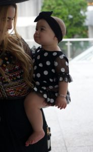 miami-fashion-blogger-kimberly-pfaehler-oh-lola-blog-midi-dress-ethnic-boho-chic-black-dress-tennis-shoes-black-hat-mommy-and-me-fashion-baby-girl-fashion-polka-dots